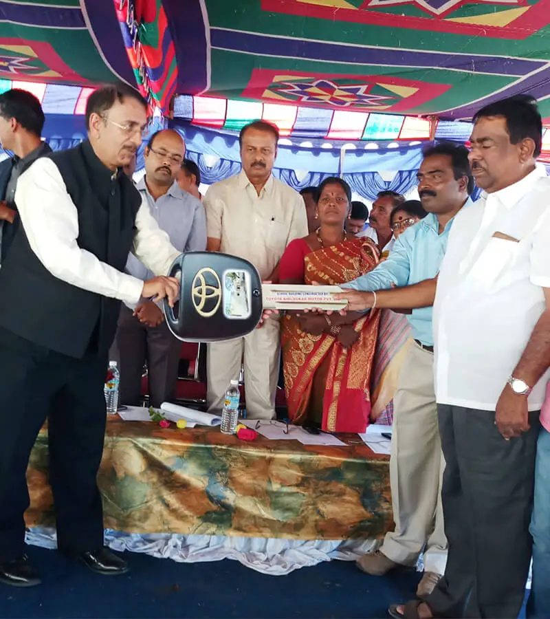 Mr.Shekar Viswanathan-Vice Chairman-Toyota Kirloskar handing over the key to Government Higher Primary School-Kupya-T Narasipura Taluk