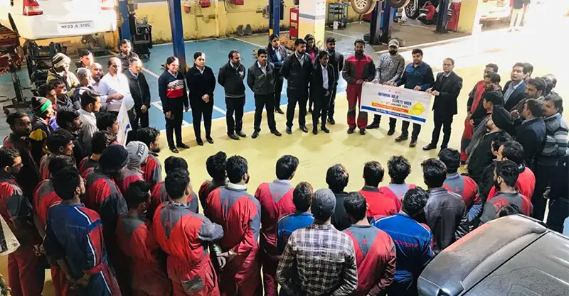 Dealer staff participating in awareness activity at the dealership as a part of Road Safety Week program