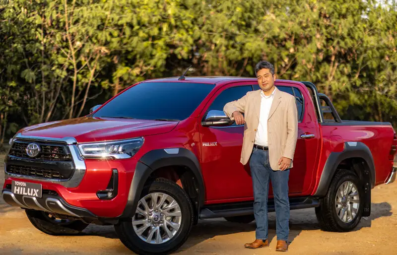 Mr Tadashi Asazuma - Vice President, Marketing, Toyota Kirloskar Motor with Toyota Hilux-min